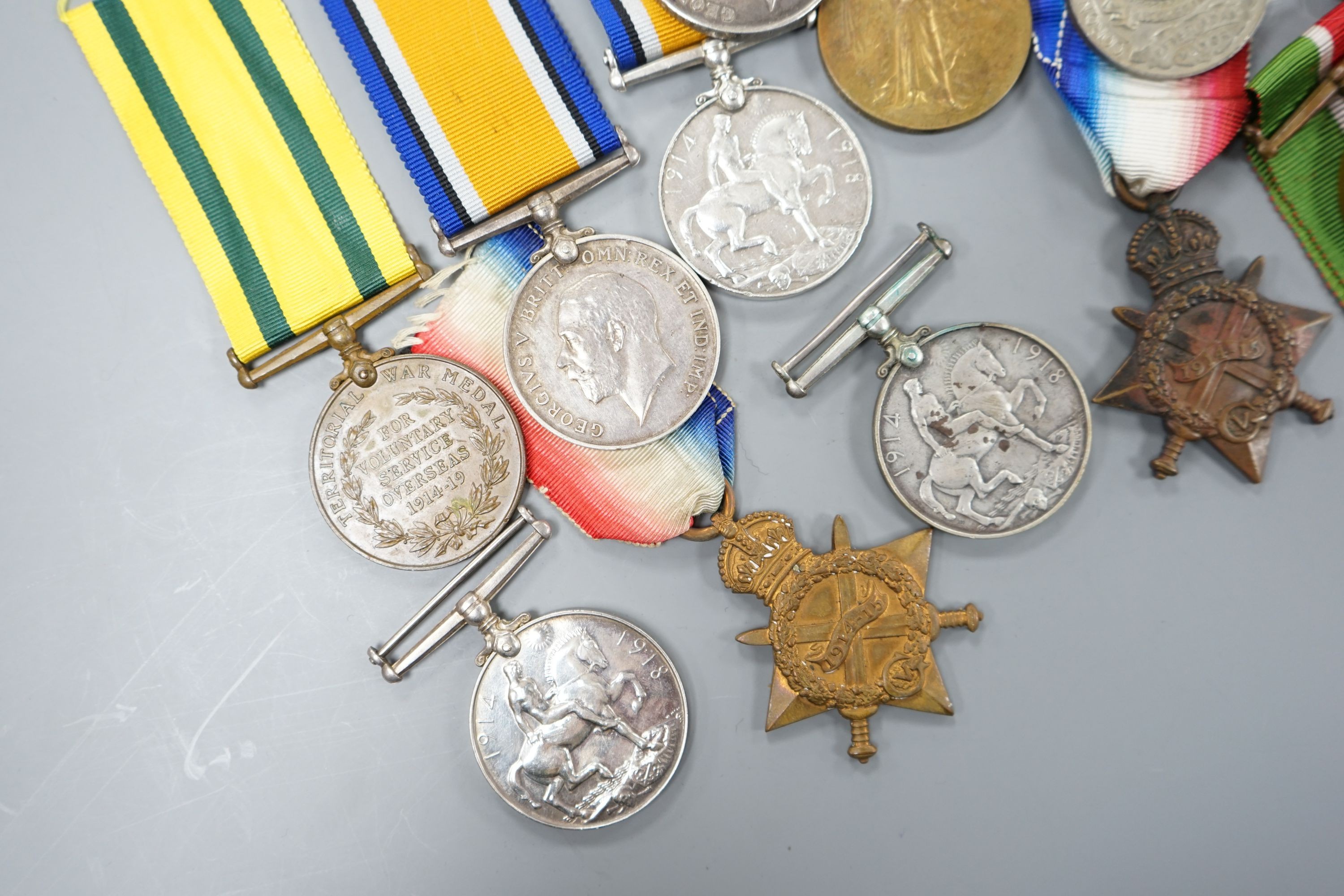 A collection of of odd WW1 medals to different recipients and a bronze death plaque to Shah Khan